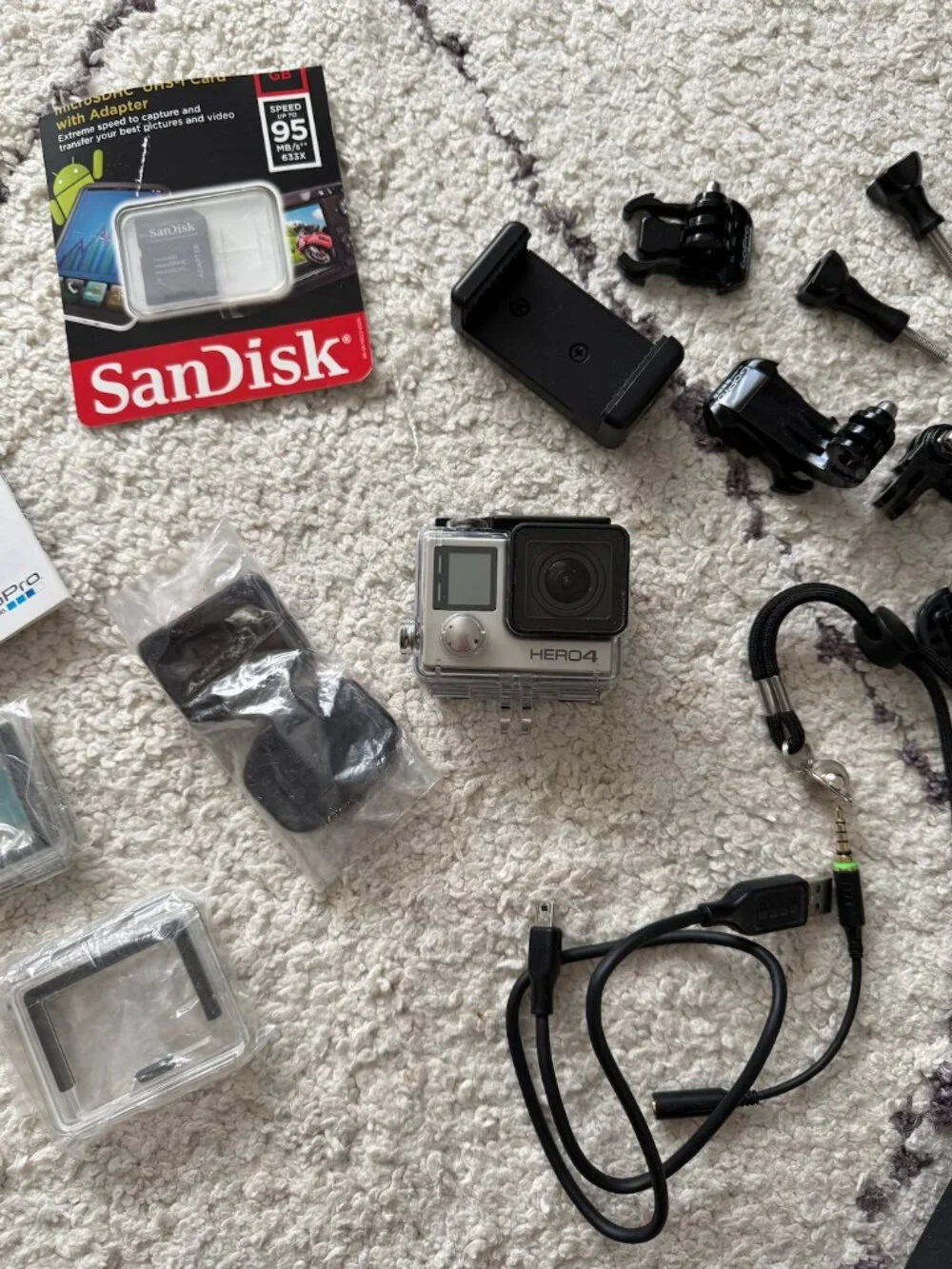Brand New Go Pro Hero 4 silver waterproof - with selfie stick, 32GB card